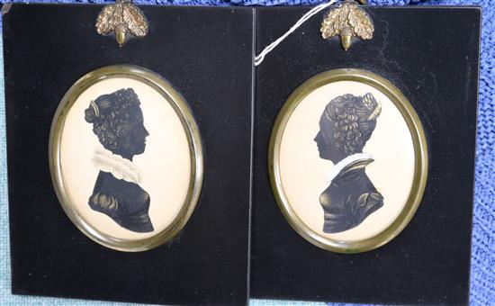 A pair of cut and gilt paper silhouettes of ladies, 8.5 x 6.5cm